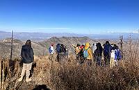 Students on a mountain ridge